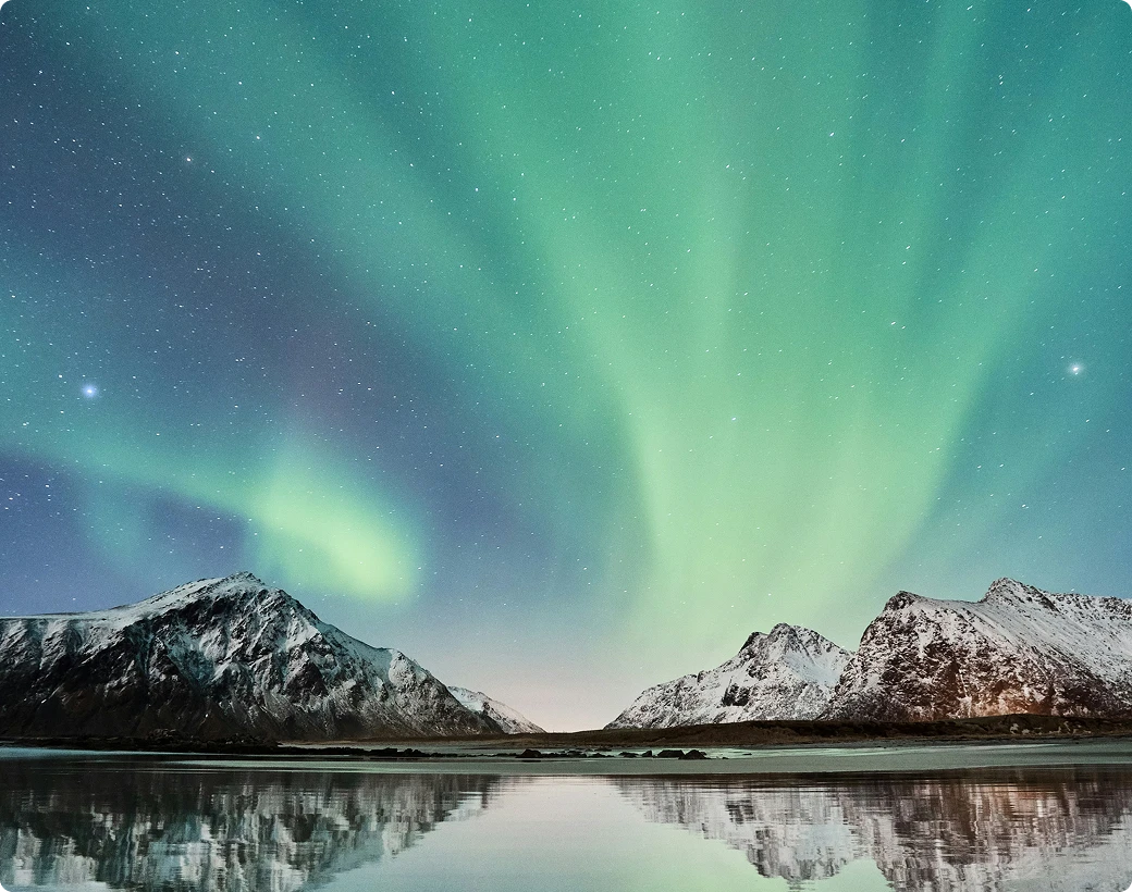 Mountains at night with northern lights