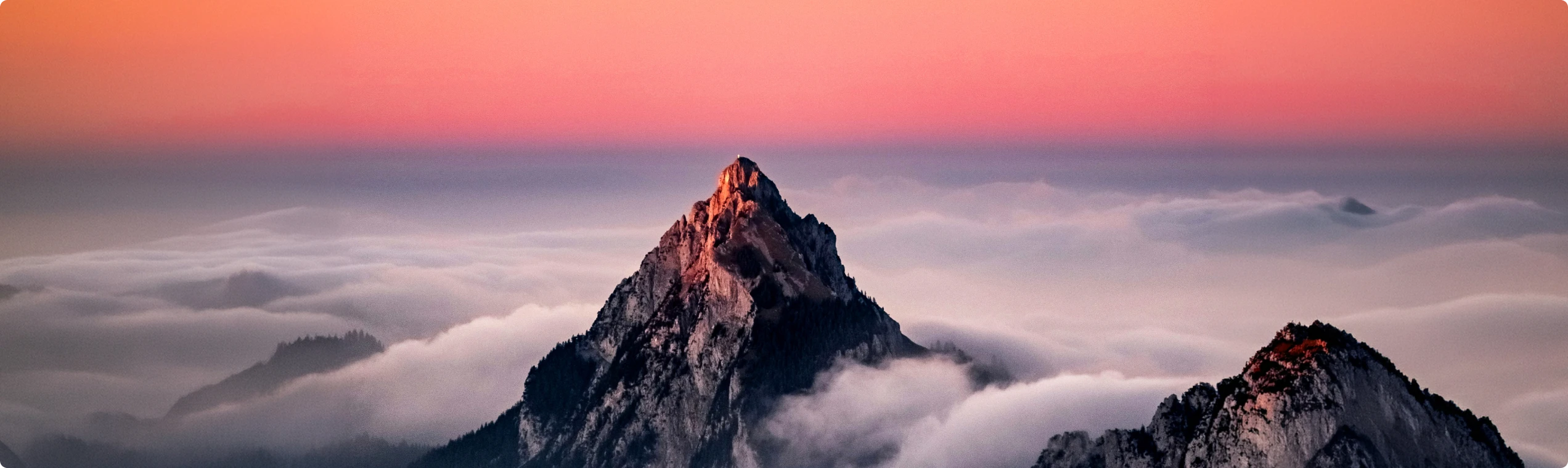 Image of mountain summit above the clouds